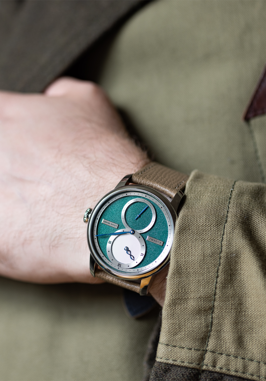 Louis Erard Le Régulateur Louis Erard x Kudoke Forest Green on a wrist | OsterJewelers.com