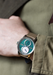 Louis Erard Le Régulateur Louis Erard x Kudoke Forest Green on a wrist | OsterJewelers.com